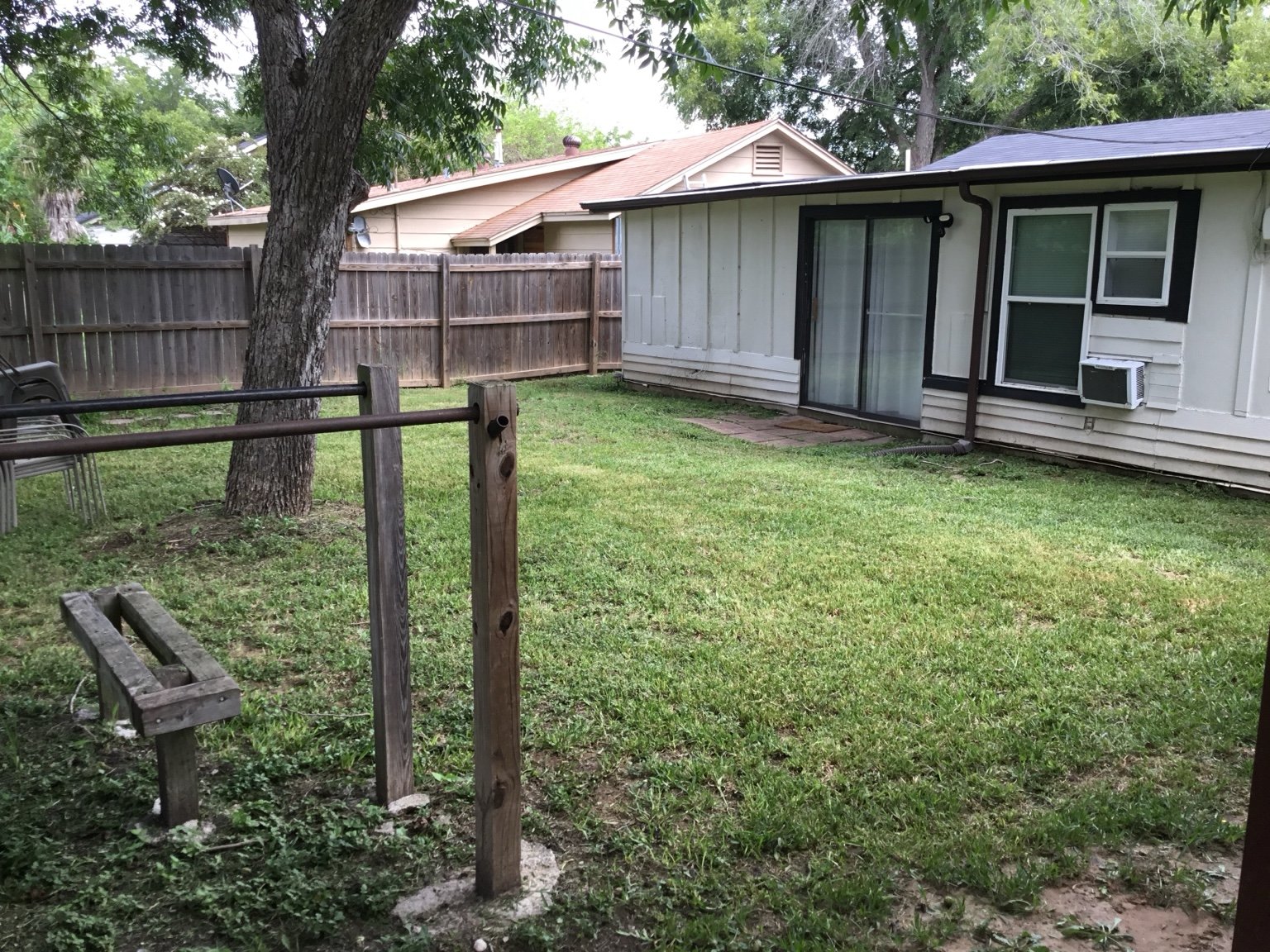 Backyard grass area by patio